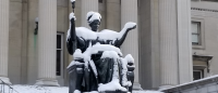 Alma statue covered in snow.
